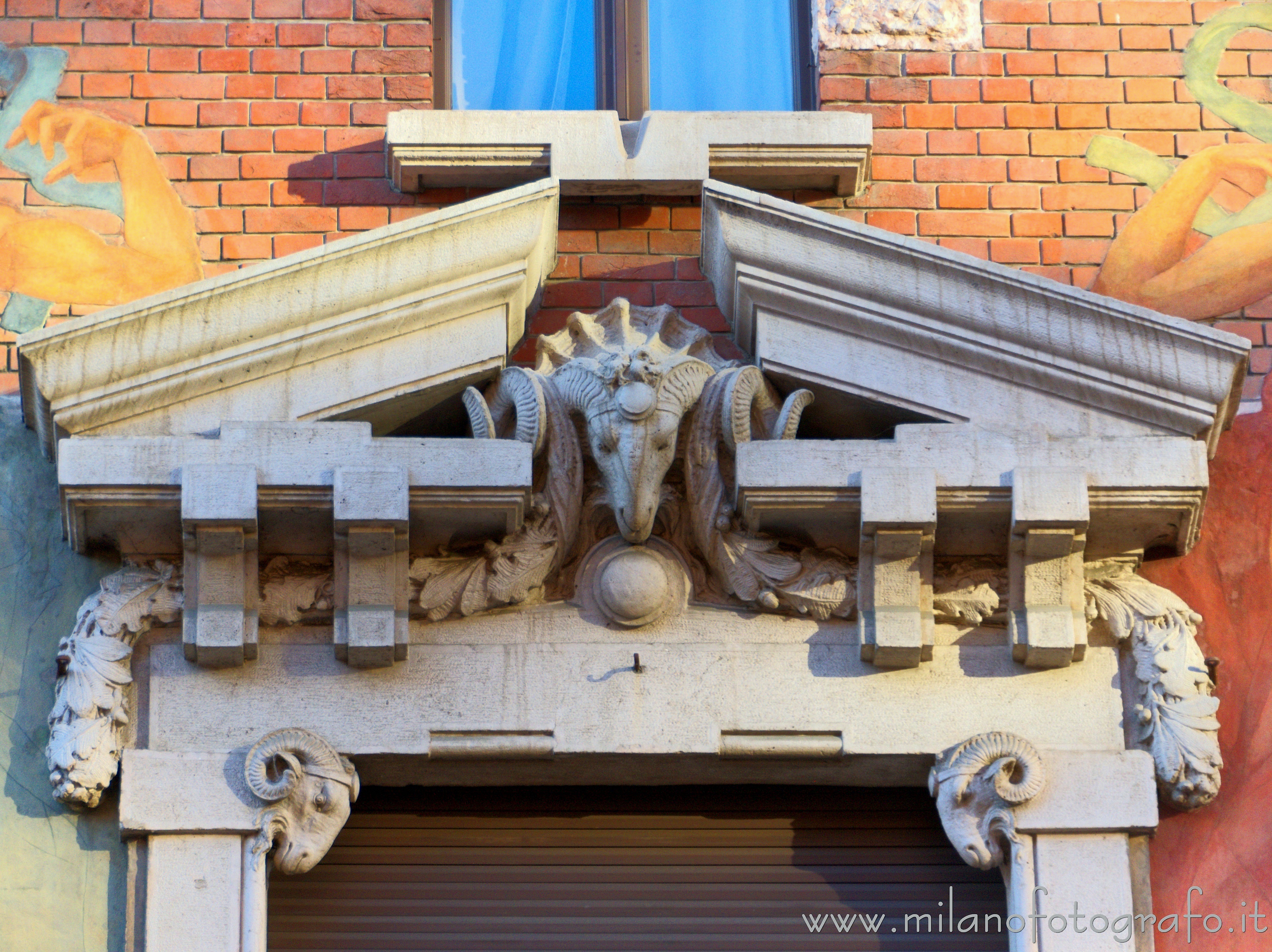 Milan (Italy) - Fronton above the central window of the Second House Berri Meregalli in the Quadrilateral of Silence